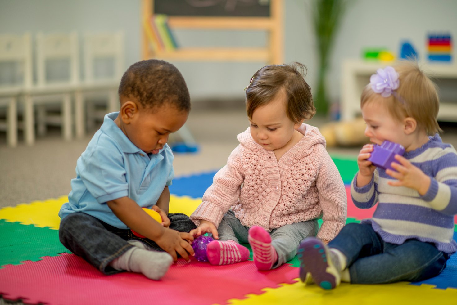 Toddlers Playing with Toys